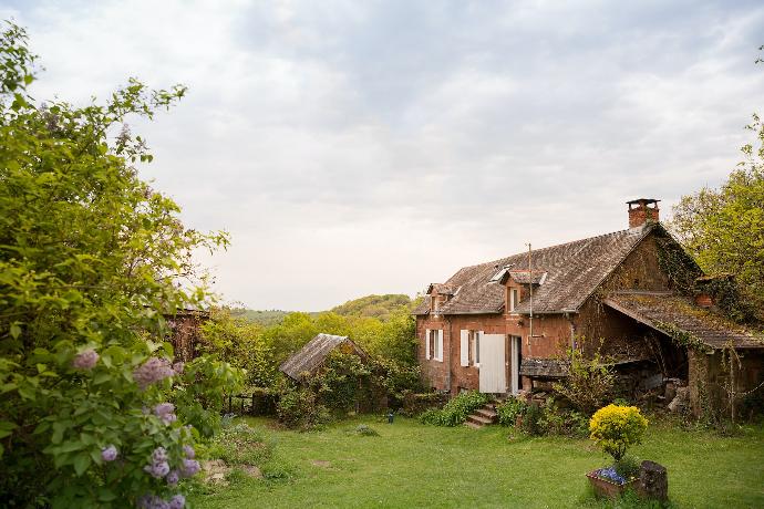 brown wooden house near at garden