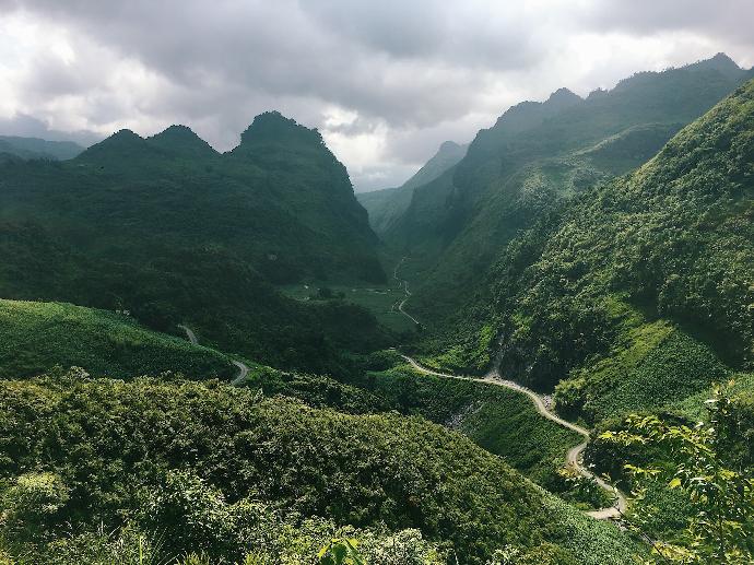 green mountains under white clouds during daytime