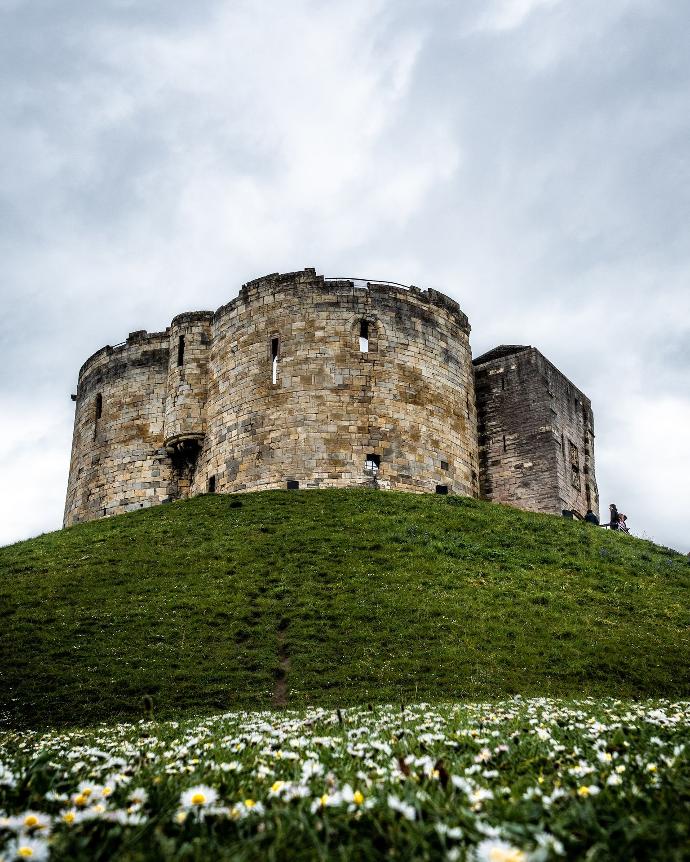 gray castle on top of hill at daytime