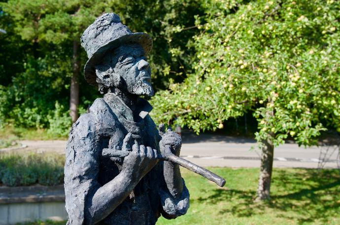 a statue of a man holding a baseball bat